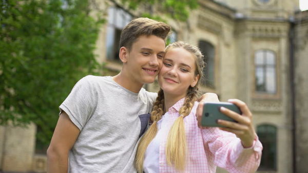 Teen Couple Making Selfie, Using