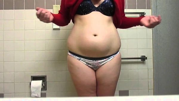 Chubby girl plays with her belly -