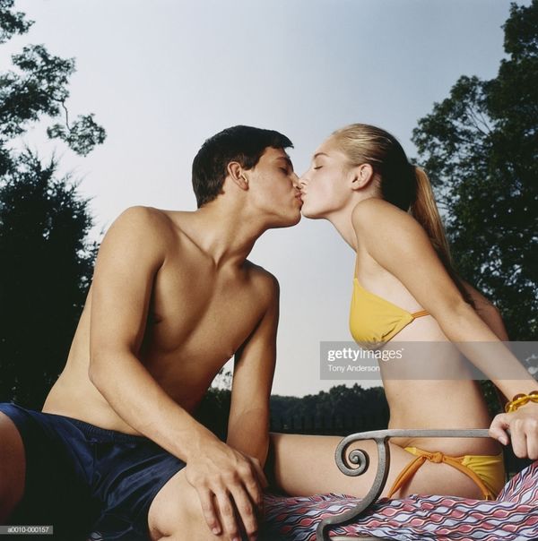 Teenage Couple Kissing Stock Photo