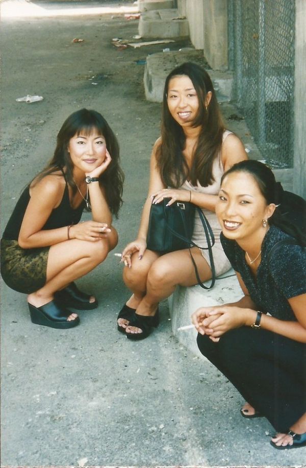 Asian-American ladies Three young women pose graciously wh.