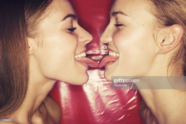 Two Teenage Girls Kissing Side View Closeup Stock Photo Gett