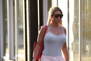 Katie Price goes braless as she shows