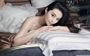 Download Beautiful Girl Resting On A Bed