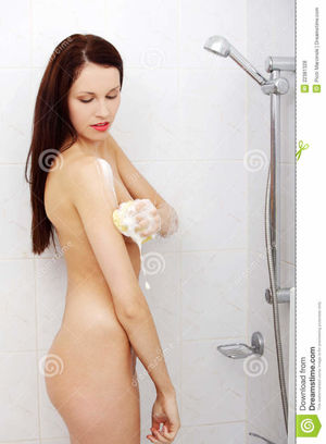Woman taking a shower. stock photo.