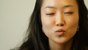Young Asian Woman Making Mouth åº“..