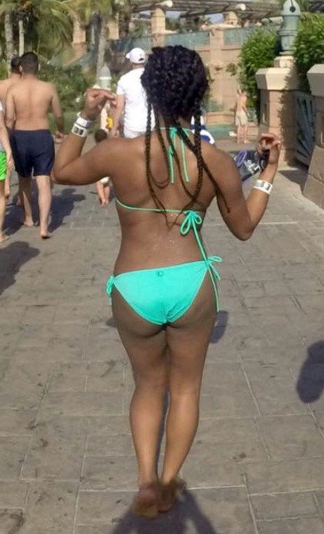 Young black girlfriend shows her selfies in bikini