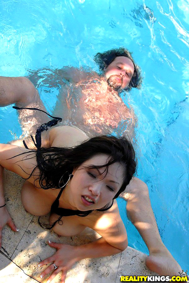 Asian MILF Alexia sucks a fat tourist's morning glory beside the pool