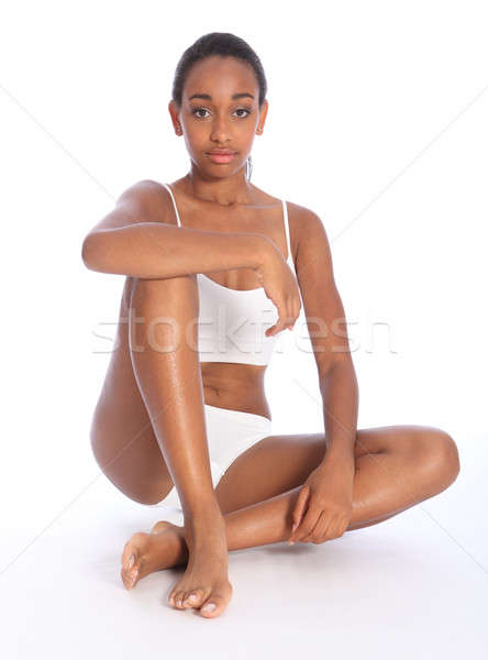Healthy young beautiful black woman sitting down stock photo
