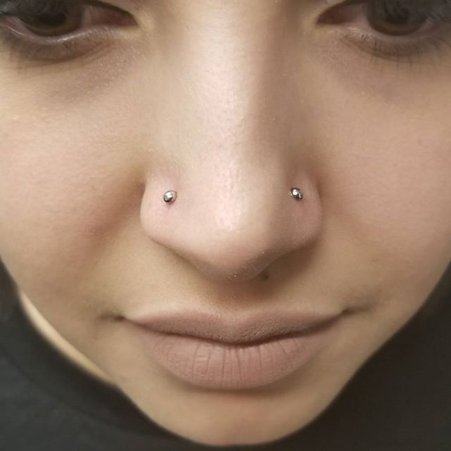 Double nostril piercings by Nikey - Emerald Tattoo Lodi, Lod